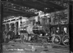 Petone Railway Workshops. Interior view of the Erecting Shop, lifting a boiler.