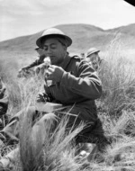 [Signalman N P Te Hau at lunch during final exercises at Waiouru]