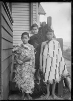 Makere Rangiatea Ralph Love, Wi Hapi Love (Jnr), and Tiwhiti Love alongside their house at Korokoro, Wellington
