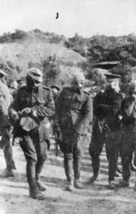 Soldiers on parade wearing gas masks, Gallipoli, Turkey. Photographed by an unknown photographer in 1915