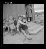 Kindergarten children playing outside their dormitory at a Polish refugee camp, Pahiatua