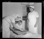 Ryszard Nowacki works on a jigsaw puzzle in a Polish refugee camp's hospital, Pahiatua