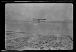 B&W Boeing seaplane "F" taxying off the beach at Kohimarama, Auckland