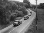 A stream of cars heading to a race meeting