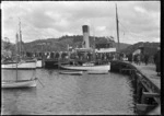 Stewart Island. The SS "Theresa Ward" at a wharf on Stewart Island, partially obscured by a crowd of people.