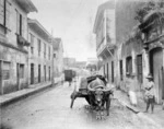 Street scene in Manila with buffalo and cart