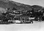 Scene at Queenstown with the paddle steamer Mountaineer alongside the wharf