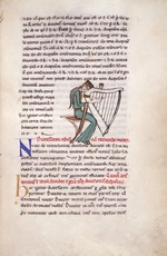 Woman tuning a medieval harp