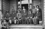 Men seated on the verandah of the Hotel Moana, probably Milford/Takapuna area, Auckland, occasion unidentified