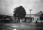 Corner of street in Milford showing Brinsleys Supply Store, Waitemata County