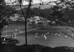 Boyer, Charles P S, fl 1920-1940 (Photographer) : Sports ground and houses, Karori, Wellington, with hockey games in progress