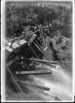 Two men 'tripping' the Anawhata dam, Piha district