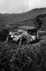 Royal Mail car on a muddy road, probably on the Gisborne - Tolaga Bay road