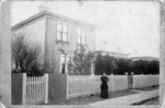 Photographer unknown : Emma Carter outside her home in Riddiford Street, Newtown