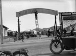 Man painting the sign at the entrance to the newly opened Kilbirnie Stadium, Wellington