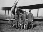 Photographer unknown: Group of seven men in front of a Bristol fighter