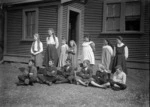 A group of primary school children with their teacher in front of Te One School, Chatham Islands