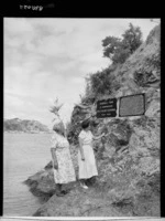Miss Hohapata and Miss Pawhara at the monument commemorating the landing of the Mataatua waka to Whakatane - Photograph taken by W Walker