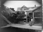 View from swimming pool of conservatory and house, Homewood, Karori, Wellington
