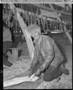 Mr H Nutira boning eels, Lake Forsyth - Photograph taken by K V Bigwood