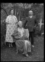 Albert Percy Godber, his wife Laura Godber, and their daughter Phyllis in their garden at Silverstream, probably on the day of Phyllis's wedding