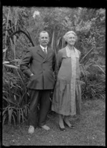 Albert Percy Godber and Laura Godber in their garden at Silverstream, probably on the day of their daughter's wedding