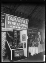 Stands at a trade fair in 1930, advertising Taradale Vineyards, Hawkes Bay, and Women's Institutes & Home Handicrafts Ltd