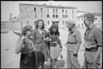 Italian women with rifles and captured German stick grenades at Massa Lombarda, Italy, during World War II