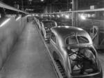 Photograph of Ford V8 motor cars on an assembly line