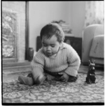 Puketapu baby, and playing cards in the kitchen at Waiwhetu Marae, Lower Hutt