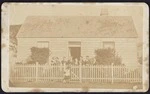 Photographer unknown :Family group portrait outside house