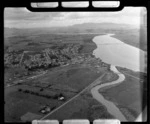 The town of Dargaville with rail station and State Highway 12 Bridge over the Wairoa River, farmland beyond, Northland