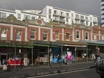 Street views in Wellington, Auckland, and small towns.