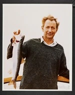 Portrait of Arthur Duncan Stout holding a trout