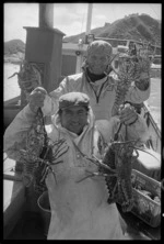 Tony and Ferdinando Cater holding up crayfish - Photograph taken by Phil Reid