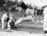 Yvette Williams long jumping at Carisbrook Park, Dunedin