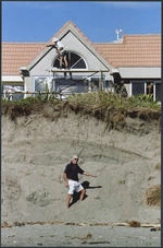 Graham Brown by the eroding sand dune in front of his Paraparaumu home - Photograph taken by Ross Giblin