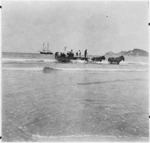 Loading wool from a dray to a whale boat at Anaura Bay, East Coast