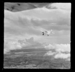 Victa aircraft (VH-FMM) in flight above Mangere, Manukau City, Auckland