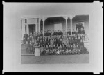Group portrait of King's College students on balcony, Remuera, Auckland
