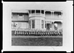 Group of King's College students in military dress holding rifles, Remuera, Auckland