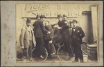 Four men on a "Victor" bicycle, Wellington.