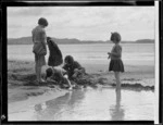 Armstrong children playing on the beach at Woolley's Bay