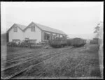 Railway yard with railway wagons and crates of dead rabbits, Burnside Freezing Works, Green Island, Taieri