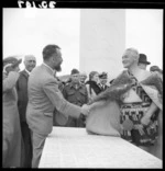 Dr van der Plas shaking hands with E T Tirikatene at unveiling of Tarakohe memorial during Tasman tercentennial celebrations