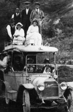 Studebaker motor car with twelve people aboard