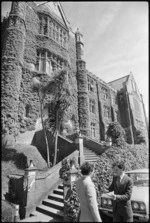 Two men speaking in front of the Hunter Building, Victoria University, Wellington