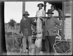 Members of the Ngawati family alongside an pou rahui used to mark eel fishing territories, Otiria, Northland