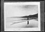 Man poling a dug out canoe on the Ongarue River