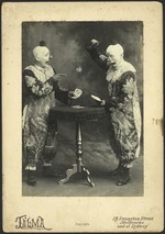 Two clowns playing cards - Photograph taken by Talma Studio